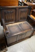 A mid 20th Century Priory style monks bench