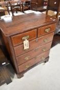 A reproduction TV cabinet, designed as Regency chest of two over three drawers