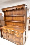 A very nice reproduction oak dresser in the period style, Titchmarsh and Goodwin or similar, width