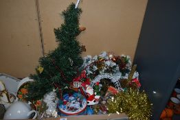 A selection of Christmas decorations including a small fibre optic tree, a Christmas wreath, a