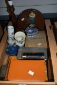 A miscellaneous collection of items including a vintage cylindrical box containing a bottle (