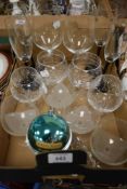 A collection of wine and spirit glasses including four Freixenet advertising champagne glasses and a