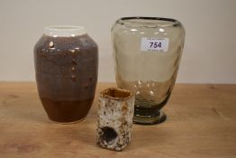 A mid 20th century clear glass ribbed vase by William Wilson for Whitefriars, 14.5cm, alongside a