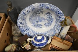 A large blue and white water dish, a vintage enamel jug with red handle, a small vintage oil lamp, a