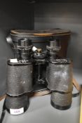 A pair of vintage Safari field binoculars, having a 7 x 50 magnification, with case