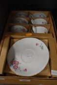 A part tea service in original box with gilt edging and pink floral design having 12 pieces.