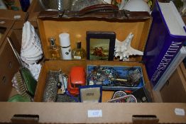 A small vintage suitcase containing a selection of assorted items including a selection of