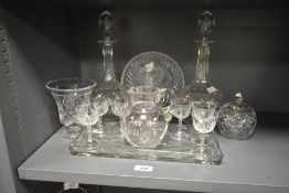A selection of cut glass ware comprising decanters, vases and short stemmed wine glasses etc.