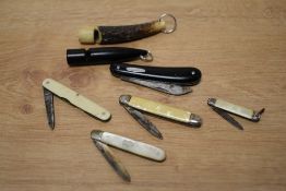 A mother of pearl hallmarked silver pen knife and four similar pen knives sold along with a horn dog
