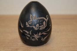 A Chinese pottery egg-shaped Xun Ocarina flute musical instrument, incised decoration of a piglet