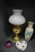 A vintage brass style electric lamp with milk glass shade, a Caithness paperweight having red and
