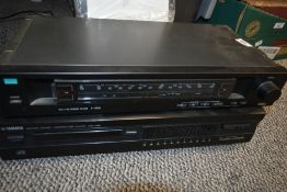 A Yamaha CD Player and a Sansui tuner.