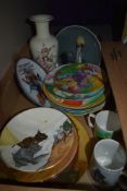 A carton of assorted display plates including a selection of vintage melamine Ronald MacDonald
