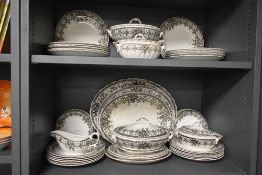A selection of Losol Ware transfer printed tableware including ashettes, dinner plates, and lidded