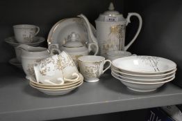 A vintage Japanese coffee set having gilted bamboo designs to white porcelain, comprising twenty