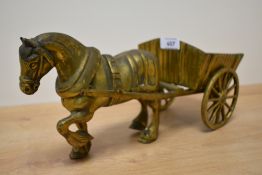 A heavy vintage brass horse and cart figurine.