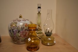 A vintage amber glass oil lamp, a similar amber glass vase, a vintage marble table lamp and a