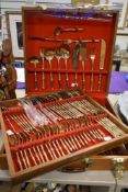 A modern oak canteen of cast nickle bronze plated cutlery, impressed factory mark 'thailand',