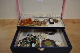 A blue and pink jewellery box, containing a small assortment of costume jewellery including beaded