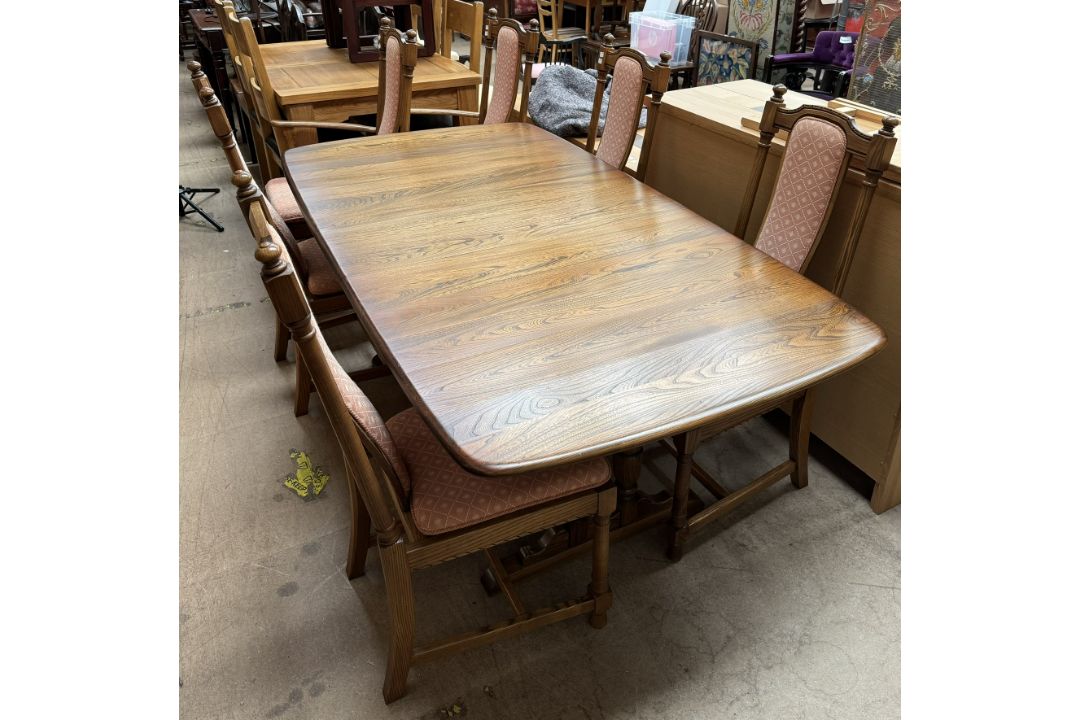 An Ercol dining suite comprising an extending dining table, - Image 3 of 3