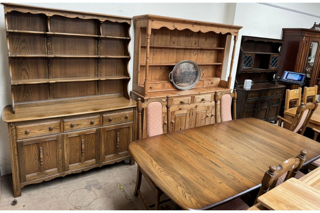 An Ercol dining suite comprising an extending dining table, - Image 1 of 3