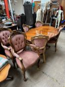 An Italian reproduction marquetry decorated dining suite comprising a dining table,