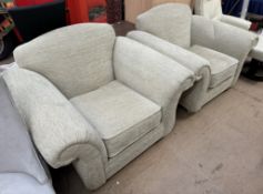 A pair of upholstered armchairs