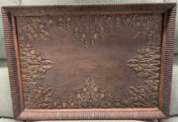 A tray of rectangular form carved with thistles