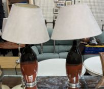 A pair of pottery two tone table lamps