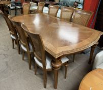A modern walnut extending dining table 217cm long x 121cm wide x 78cm high,