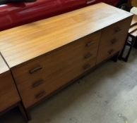 A mid-20th century G-Plan teak chest with a rectangular top above six drawers on shaped legs 131cm