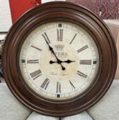 An oversized wall clock with Roman numerals