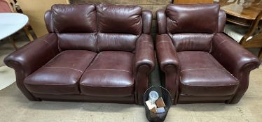 A brown leather two seater settee together with a matching armchair