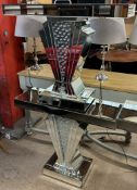 A pair of mirrored side tables of rectangular form with fan shaped supports on rectangular bases