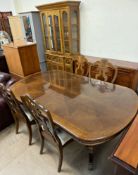 A reproduction extending dining table and four chairs together with a modern wall unit and a
