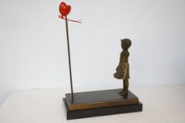 Bronze girl with balloon inspired by Banksy