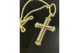 Liberace's chain & cross pendant. 14 carat yellow go