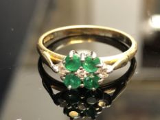 18ct Gold ring set with 4 emeralds & 3 diamonds We