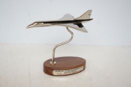 Chrome Concorde on wooden base