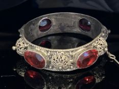 White metal bangle set with 4 large red stones Wei