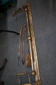 Brass fire fender with fire irons
