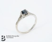 Beaverbrooks 18ct White Gold Sapphire and Diamond Halo Ring