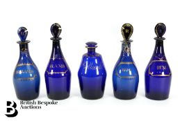 Five Georgian Bristol Blue Decanters and Stoppers