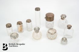 Eleven Silver Topped Vanity Jars