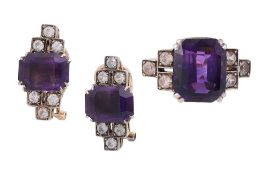 An Art Deco Amethyst and white stone ring and ear clips