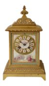 A late 19th century French ormolu and Sevres style porcelain mantle clock