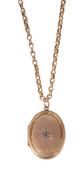 An oval locket pendant