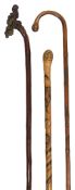 A late 19th century Chinese walking stick and two Japanese walking sticks
