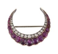 A ruby crescent brooch