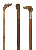Three novelty dog head walking canes c.1900